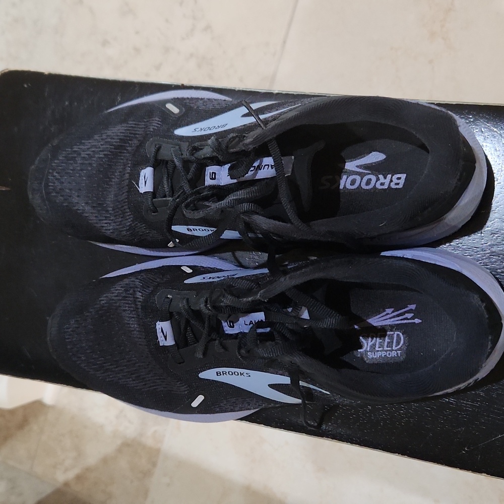 Brooks women's sneakers.  Black and lavender trim. Gently worn. Good condition.